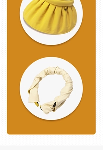 Detail of roll-up shell sun visor showing wide pleated brim and foldable headband style