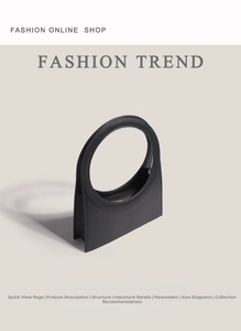 Macro shot of minimalist black trapezoid leather bag with large circular cutout handle