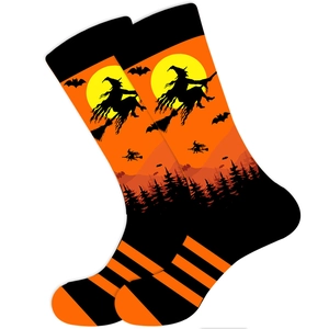 Halloween crew socks featuring orange and black witch, bat, and full moon patterns