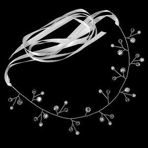 Detail of bridal hair vine with blue crystals and white pearls on silver wire