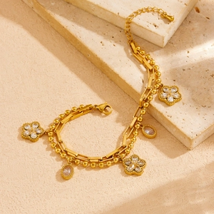 Double-layer gold plated stainless steel bracelet with floral and crystal pendants on stones