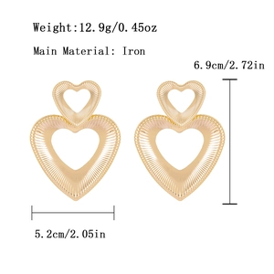 Golden double heart earrings with radial texture and vintage metallic design