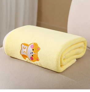 Detailed view of yellow coral fleece baby towel with cute cartoon corgi embroidery