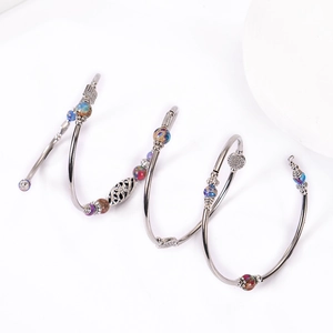 Bohemian multi-layer wrap bracelet featuring imperial stone beads and silver metal charms