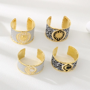 Exaggerated wide stainless steel cuff bracelets with sun and moon pattern in gold finish
