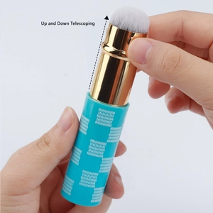 Detail showing the up and down telescoping function of this blue cat paw makeup brush
