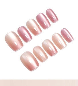 Pink cat-eye gradient press-on nails with shimmering pearlescent finish and short square shape