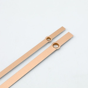 Minimalist rose gold metal clock hands set with brushed finish on white background