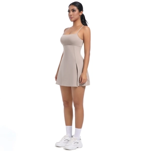 Side view of beige athletic dress with thin straps and side slit for tennis and golf