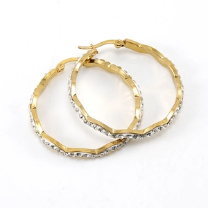 Sparkling gold wavy hoop earrings with embedded rhinestones in a modern geometric style