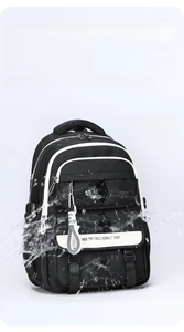 Waterproof detail of black oxford backpack showing high-density water-resistant fabric