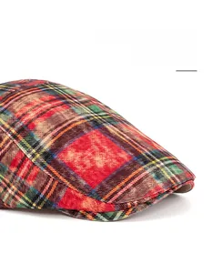 Detail of tartan pattern newsboy cap with wide foldable brim for face contouring