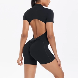 Detail of the back oval cutout and scrunch butt design on the black yoga bodysuit
