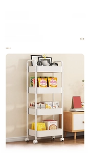 Close-up of a white 4-tier rolling cart storage rack used for snacks in a modern living room