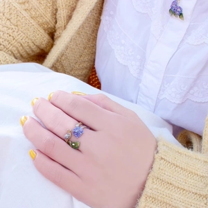 Adjustable enamel ring featuring purple hydrangea and snail design on model hand