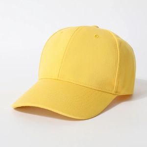 Detail view of a bright yellow cotton baseball cap with embroidered eyelets and plain visor