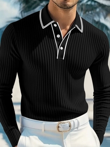 Detail of black long-sleeve polo shirt with ribbed texture and white contrast piping trim