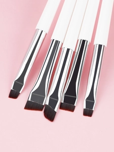 Detailed view of 5-piece angled eyeliner and eyebrow brushes with white matte handles