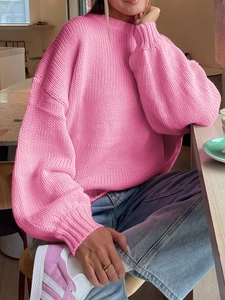 Pink crewneck knit sweater featuring relaxed loose fit and stylish lantern sleeves