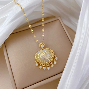 Luxurious gold titanium necklace with a ruyi lock pendant featuring white jade and tassels