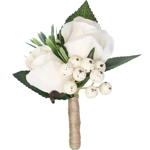 White rose boutonniere with green leaves and berries wrapped in rustic hemp rope