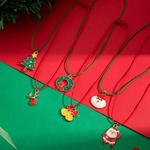 Christmas charms bracelets with colorful Santa Claus and Reindeer pendants on woven ropes