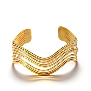 Detailed view of gold geometric wavy cuff bracelet with parallel metallic layers