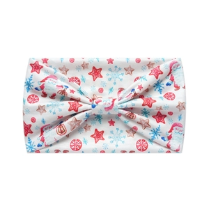 Detail of Christmas headband with Santa Claus, snowflakes, and stars on white fabric