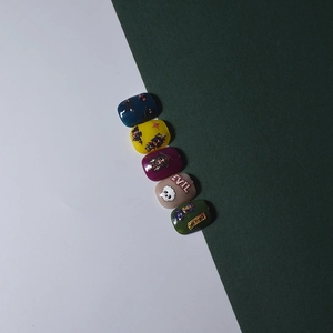Detailed view of 5D Halloween nail stickers featuring evil ghost and witch designs