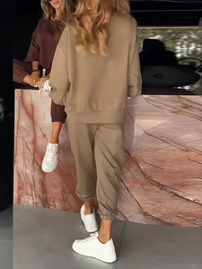 Close-up of knit sweatshirt cuffs and drawstring waist on casual wide-leg trouser sets