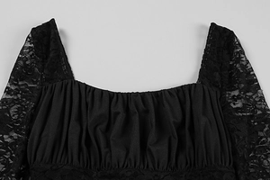 Detail of square neckline with ruched chest and floral black lace sleeves on a slim dress