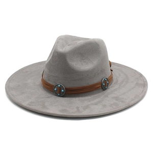 Detail of grey suede fedora hat with turquoise studded leather band and flat wide brim