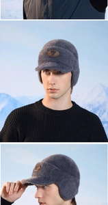 Close-up of grey-blue knit winter hat with earflaps and plush thermal lining detail
