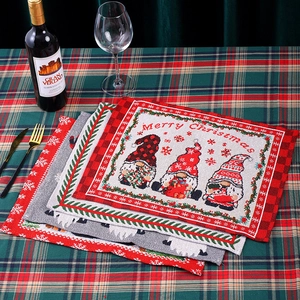 Christmas gnome heat-resistant placemats with Merry Christmas text on checkered background