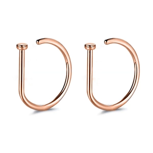 Pair of rose gold D-shaped nose rings with a smooth polished finish and flat disc ends