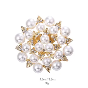 Detailed view of a round pearl flower brooch with gold alloy leaves and 5.2cm dimensions
