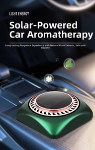 Solar powered car aromatherapy diffuser in dark green finish on leather armrest