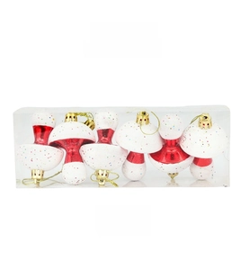 Set of 6 red glitter mushroom Christmas ornaments in clear rectangular packaging
