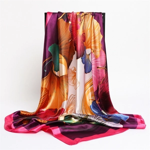 Elegant satin scarf with colorful ginkgo leaf print and smooth silky texture for women