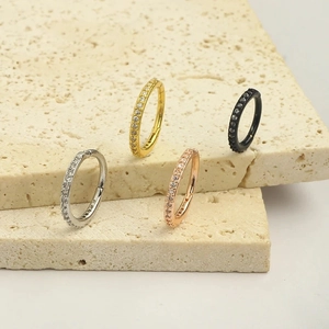 Set of four crystal-studded stainless steel nose rings in silver gold rose gold and black
