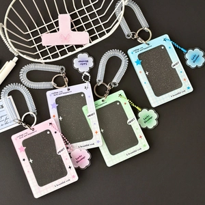 Acrylic four-leaf clover photocard holders in pink, purple, blue and green with cloud charms