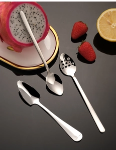 Detail of 3-piece stainless steel fruit carving tool set including serrated scoop