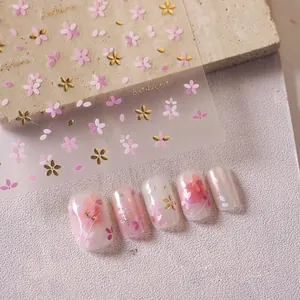 Detail of M-356 sakura nail stickers featuring pink petals and gold foil embossing