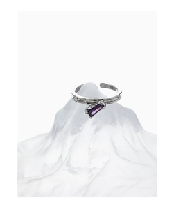 Macro shot of S925 sterling silver ring featuring a purple baguette-cut gemstone