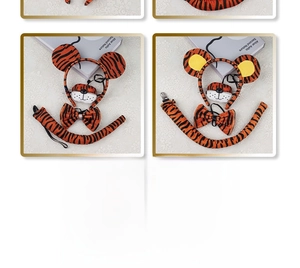 Detailed four-piece tiger costume set with plush ears, bowtie, tail, and nose accessory