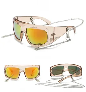 Three views of Y2K oversized sunglasses with amber frames, orange mirror lenses and silver chain