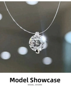 Macro shot of brilliant round cut moissanite pendant on a minimalist invisible chain