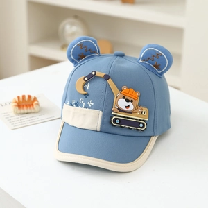 Detailed embroidery of a bear driving an excavator on a blue kids baseball cap