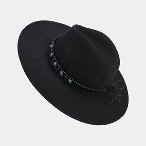 Detail of wide brim fedora with turquoise bead leather band and woven bow detail