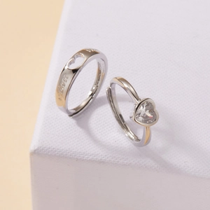 Detail of silver heart rings set with 'Endless' engraving and zircon stone detail